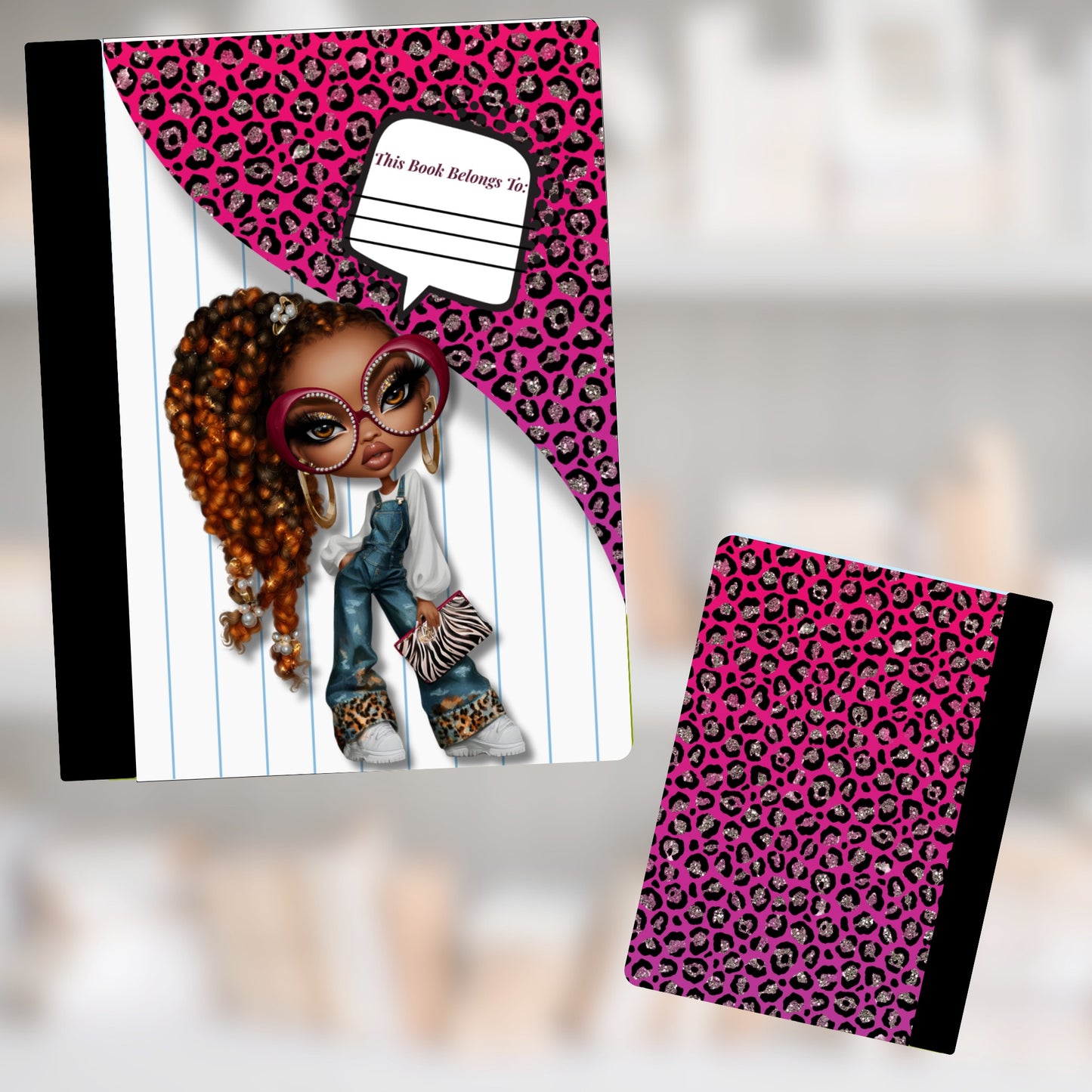 Front cover of a notebook featuring a cartoon girl with pink leopard print and "This book belongs to:" imprint.