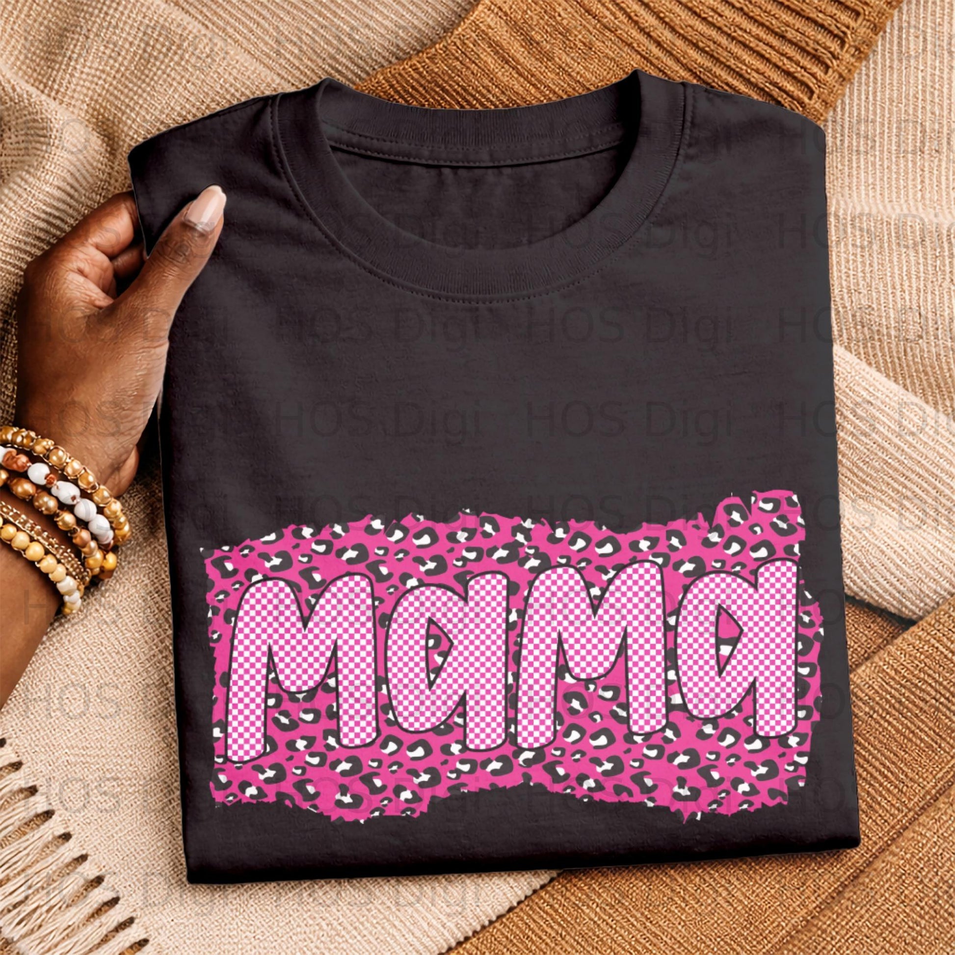 Black t-shirt with pink and white checkered "Mama" graphic on leopard print.