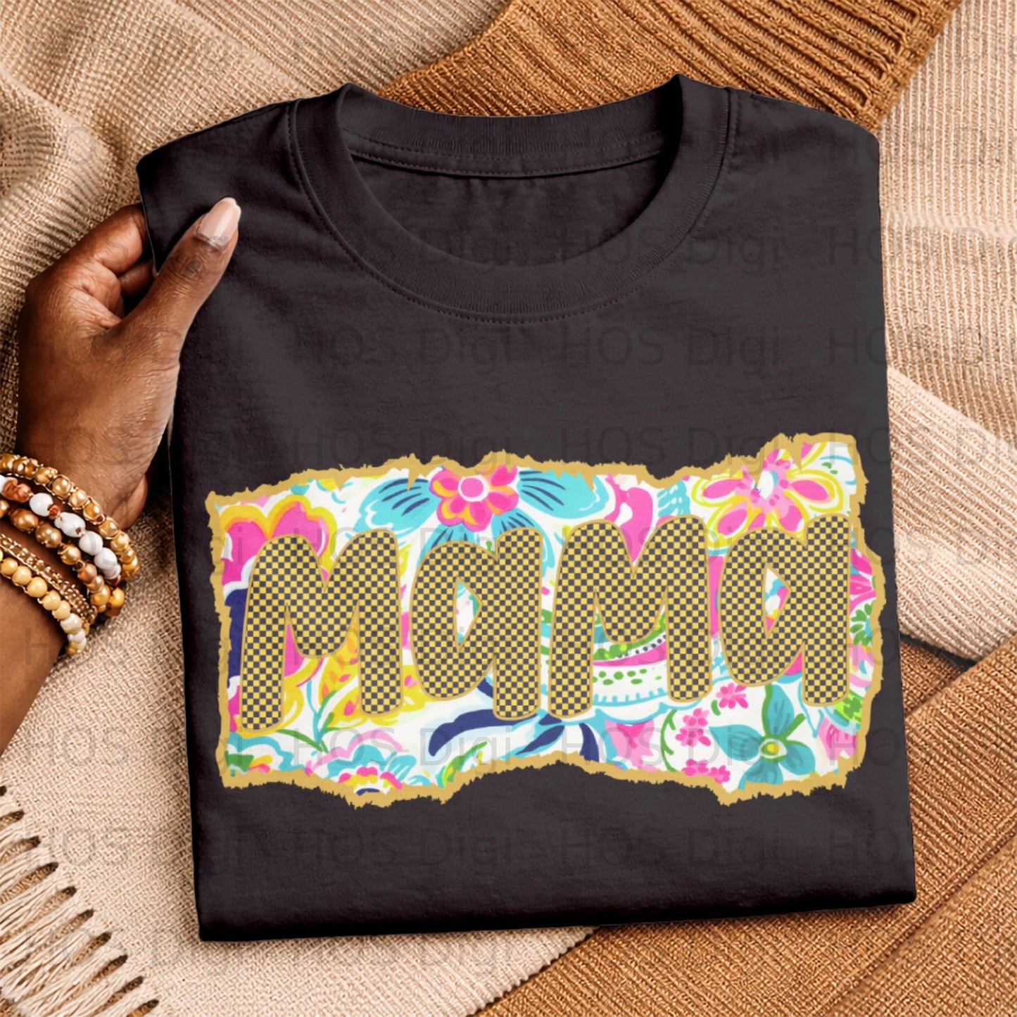 Black t-shirt with colorful floral and checkered "Mama" graphic.