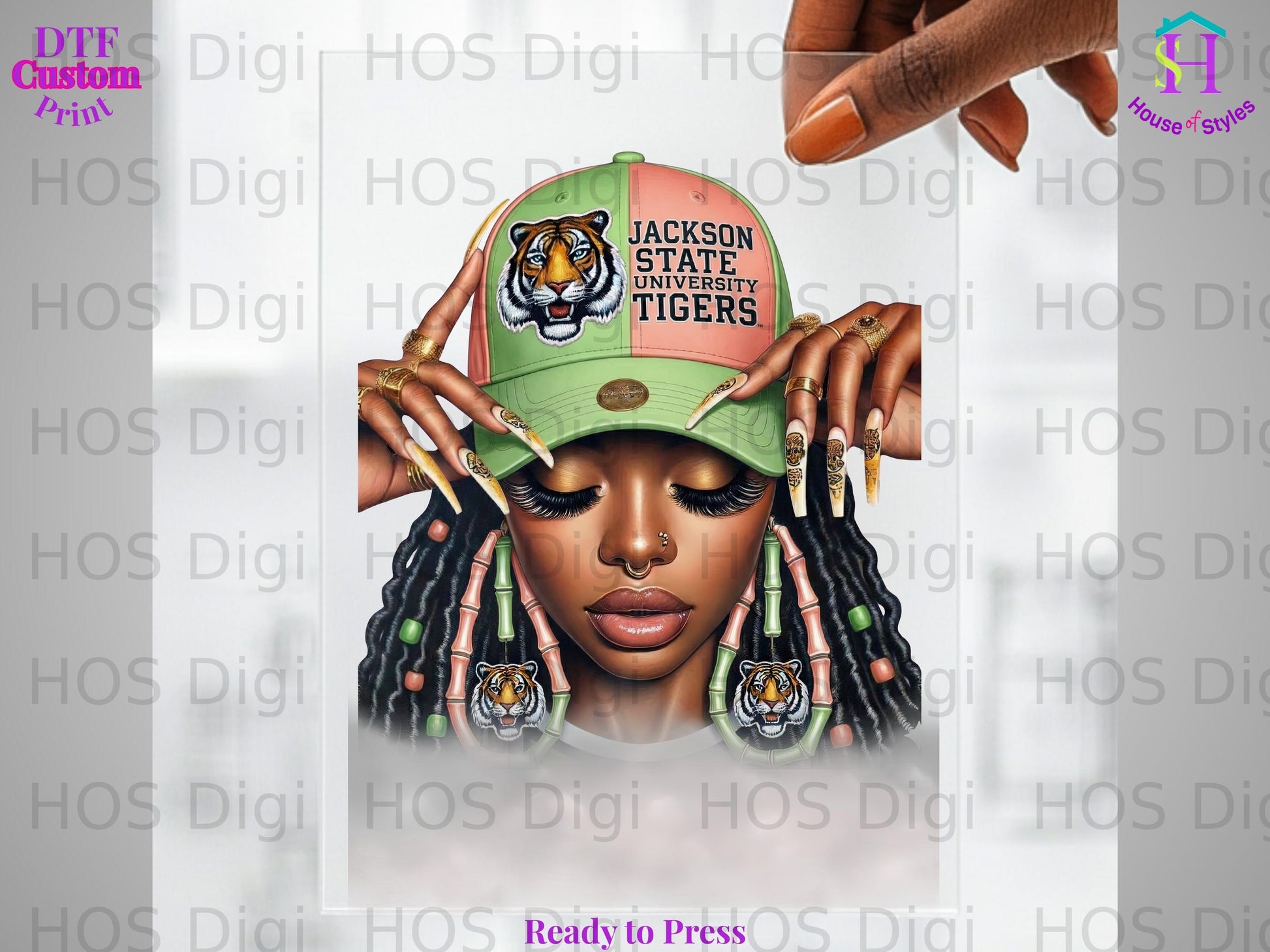 Woman wearing Jackson State University Tigers hat and tiger earrings.