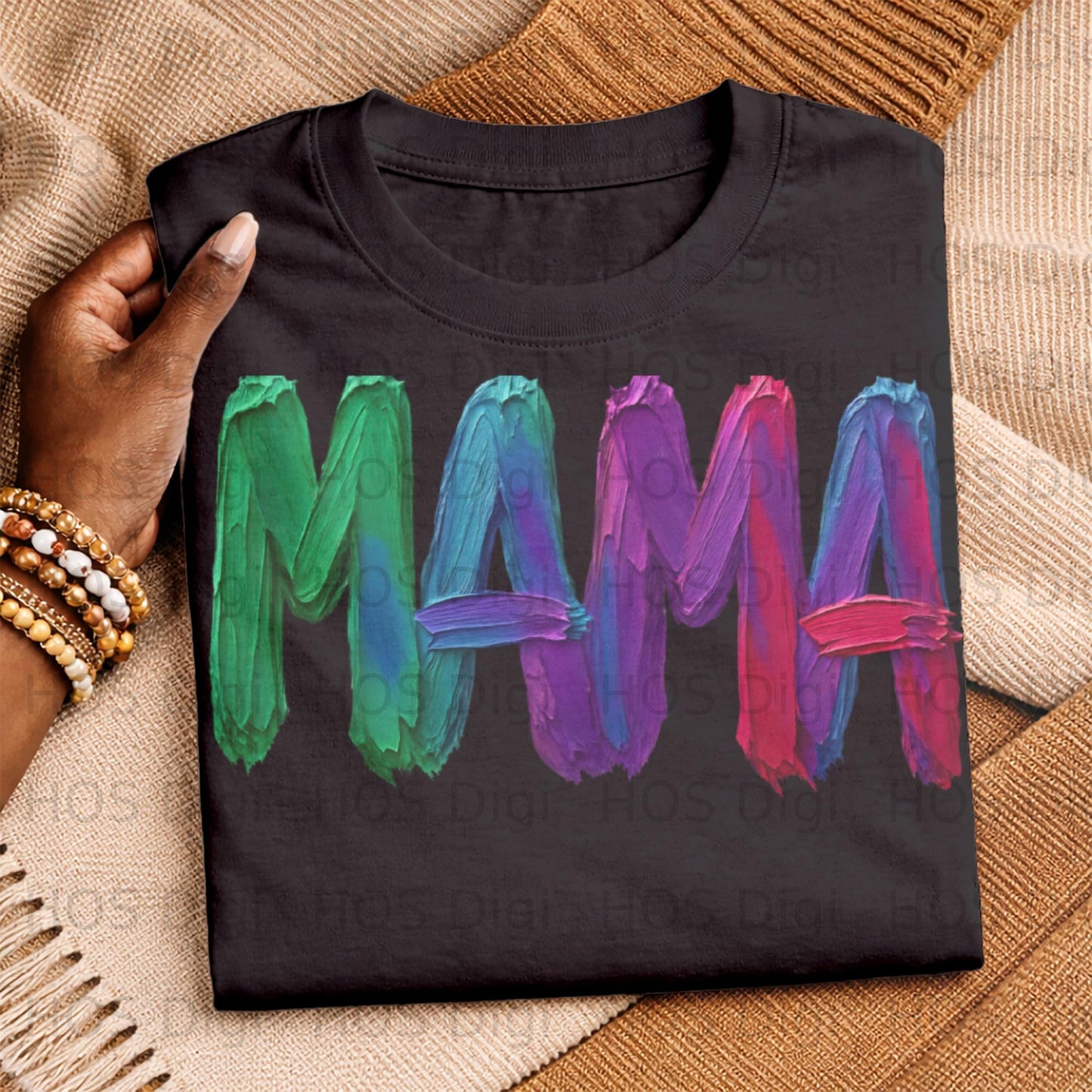 Black t-shirt with "MAMA" in colorful, brushstroke lettering.