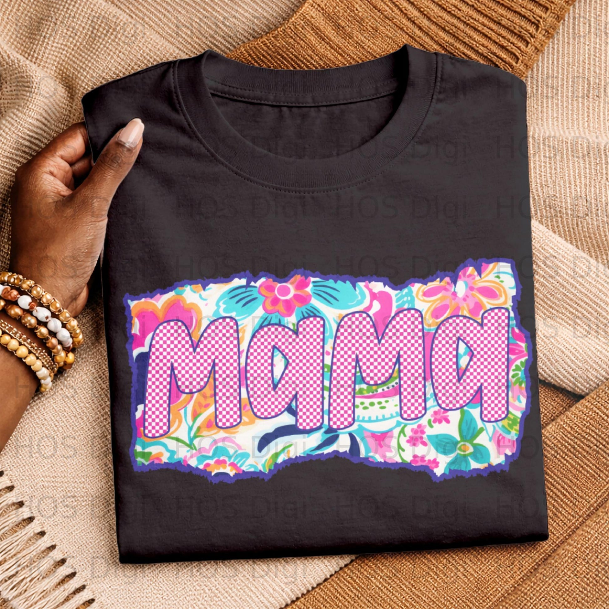 Black t-shirt with "Mama" in colorful floral and plaid pattern.