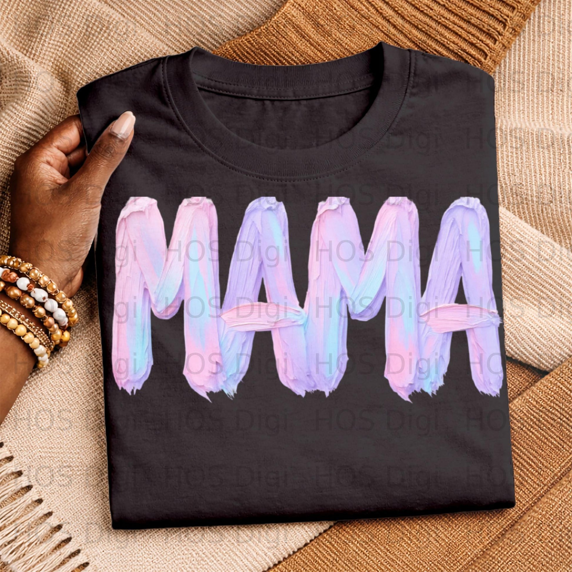 Black t-shirt with "MAMA" in watercolor-style pastel lettering.