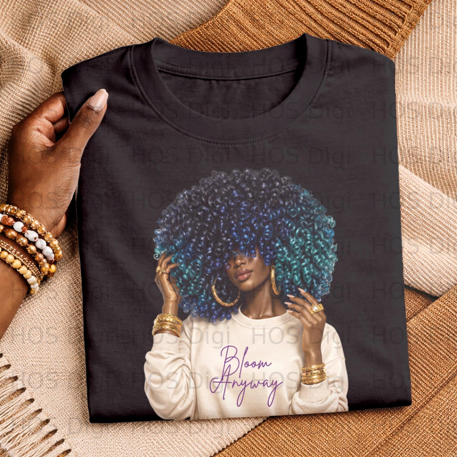 Black t-shirt with graphic of woman with colorful afro and "Bloom Anyway" text.