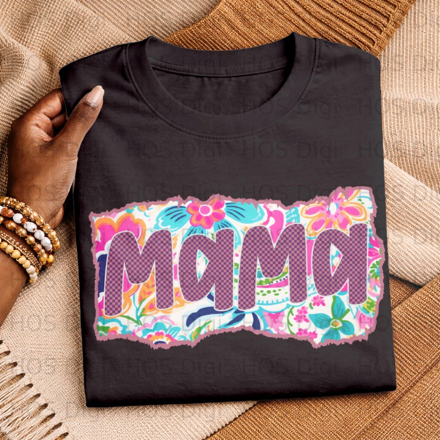 Black t-shirt with "MAMA" in pink and purple letters on floral background.