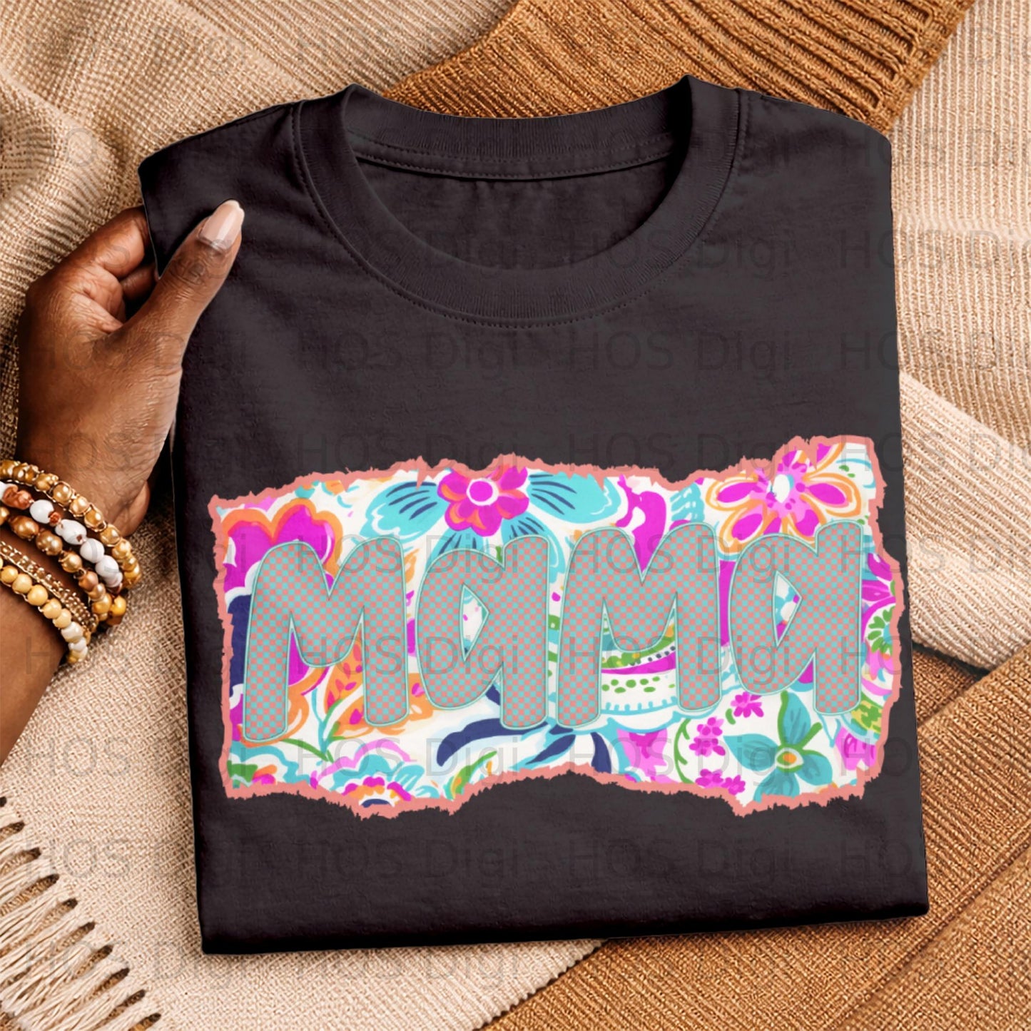 Black t-shirt with "Mama" text and colorful floral background design.