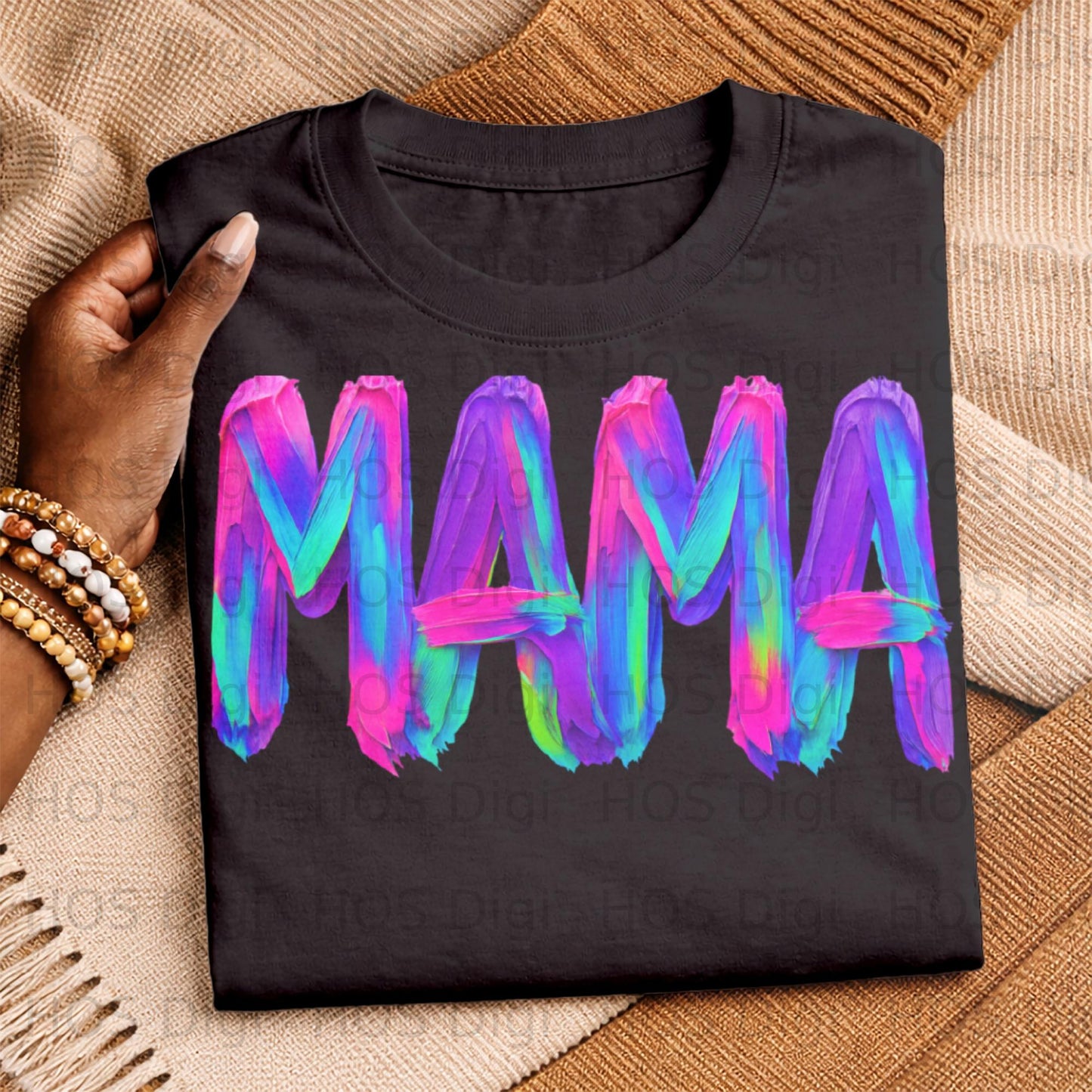 Black t-shirt with "MAMA" in colorful brushstroke lettering.