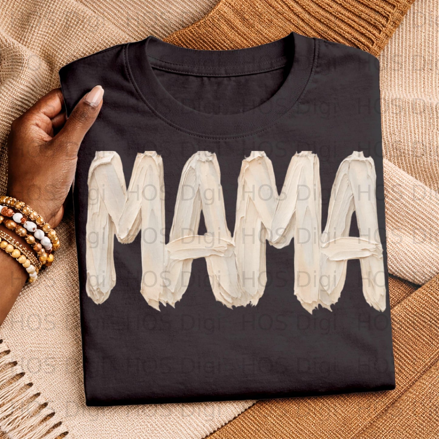 Black t-shirt with "MAMA" in textured white paint strokes.
