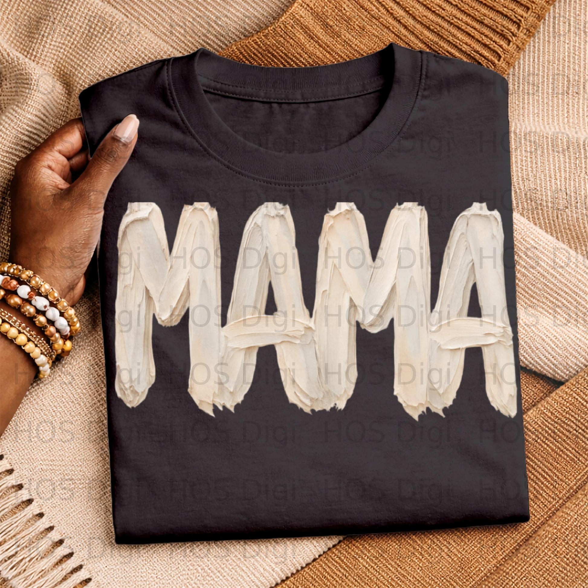 Black t-shirt with "MAMA" in textured white paint strokes.