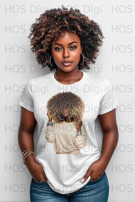 Woman with curly hair wearing a cream-colored t-shirt and jewelry.