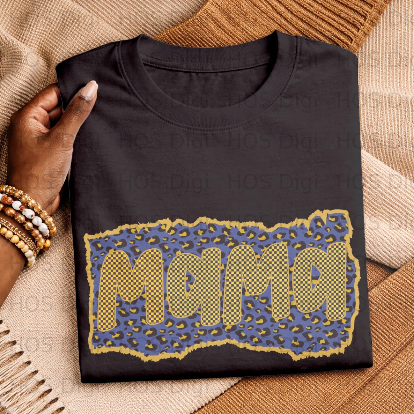 Black t-shirt featuring "Mama" text in a blue and yellow checkered pattern on leopard print.