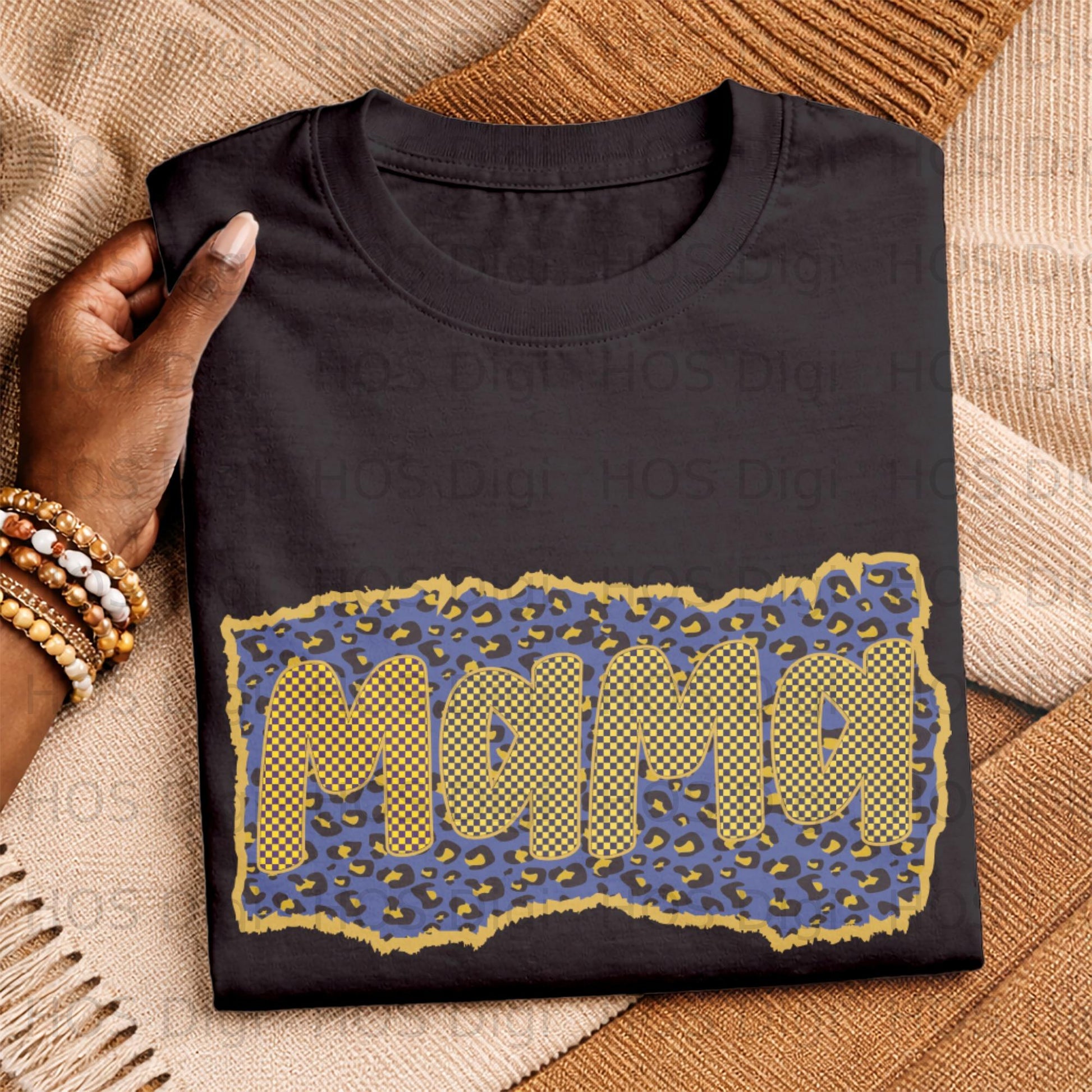Black t-shirt featuring "Mama" text in a blue and yellow checkered pattern on leopard print.