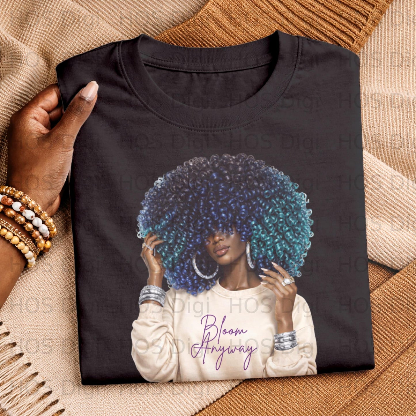 T-shirt featuring a woman with blue and purple curly hair, text reads "Bloom Anyway".