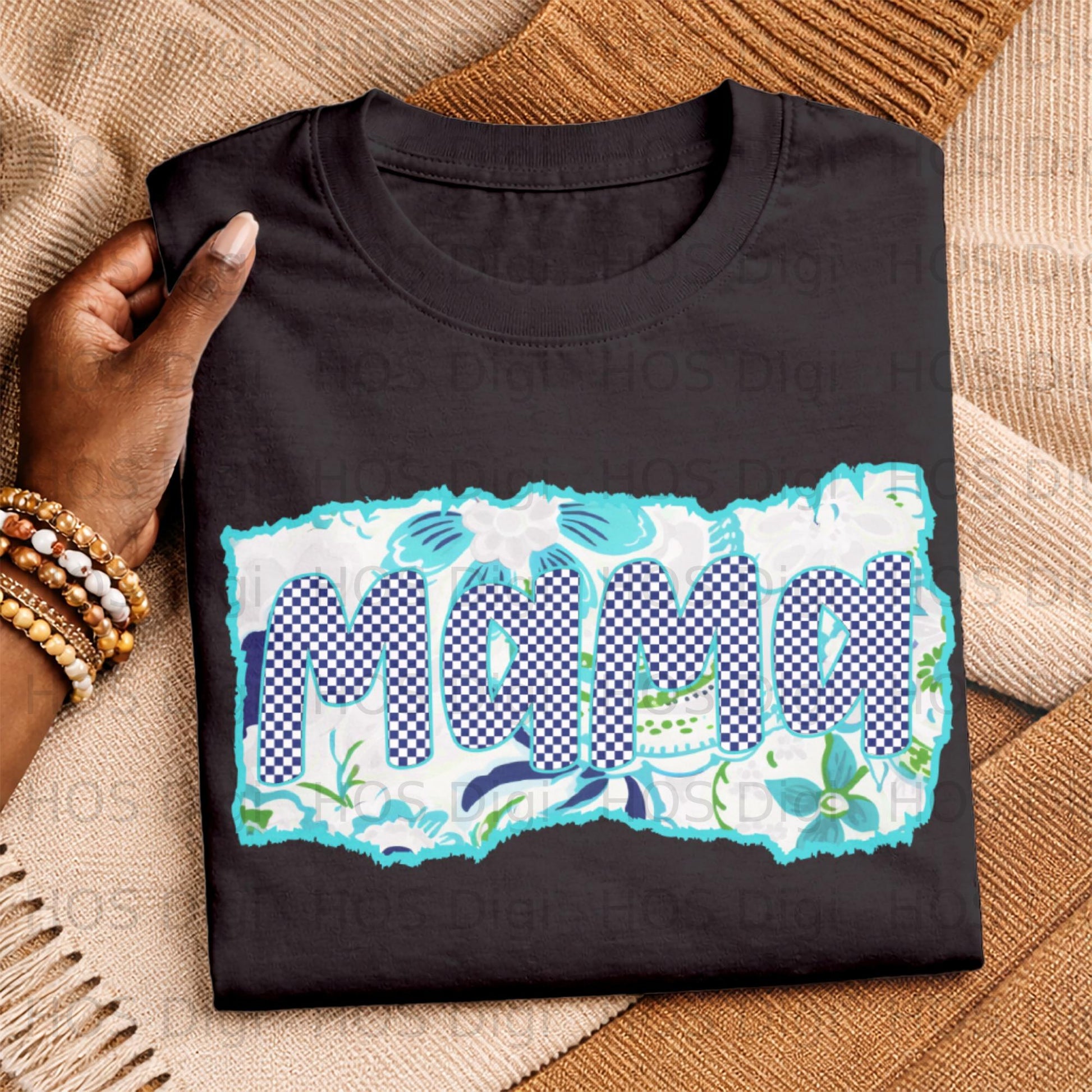 Black t-shirt with "Mama" in blue checkered and floral pattern.