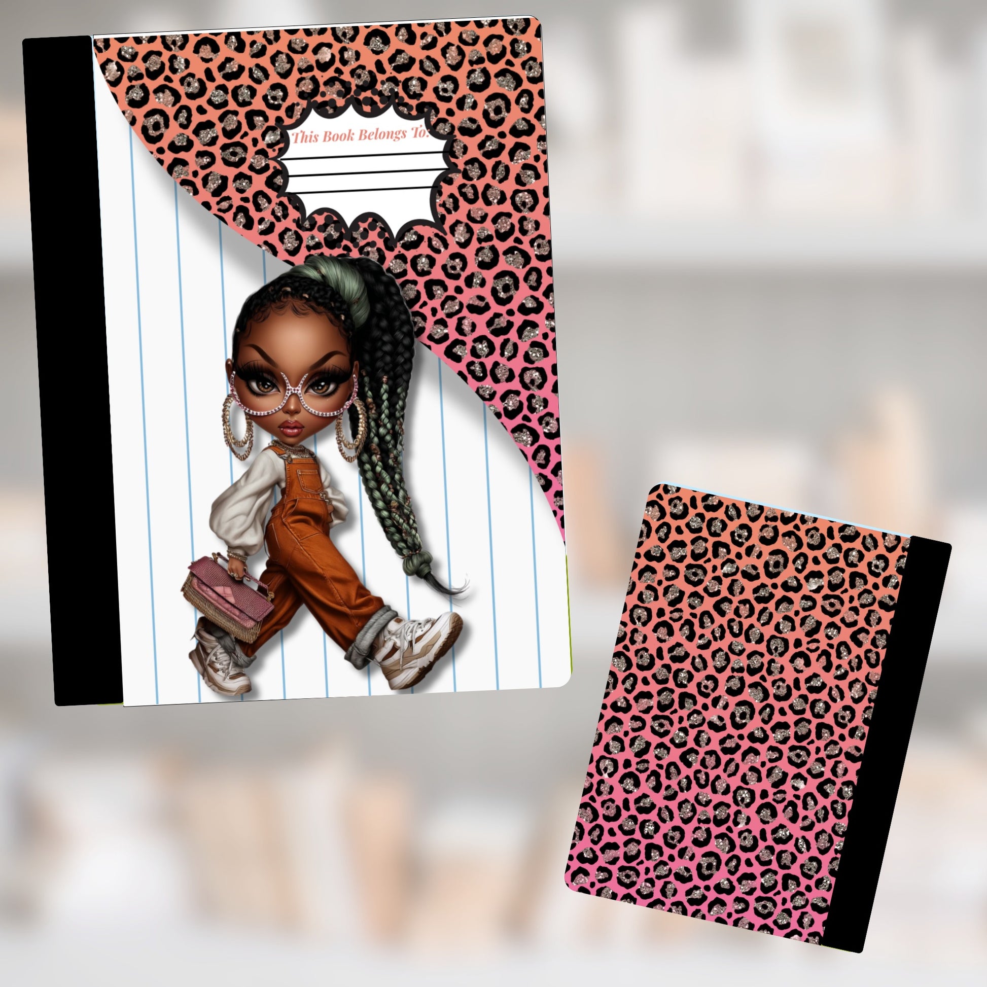 Notebook with leopard print and cartoon girl; "This book belongs to" on lined paper.