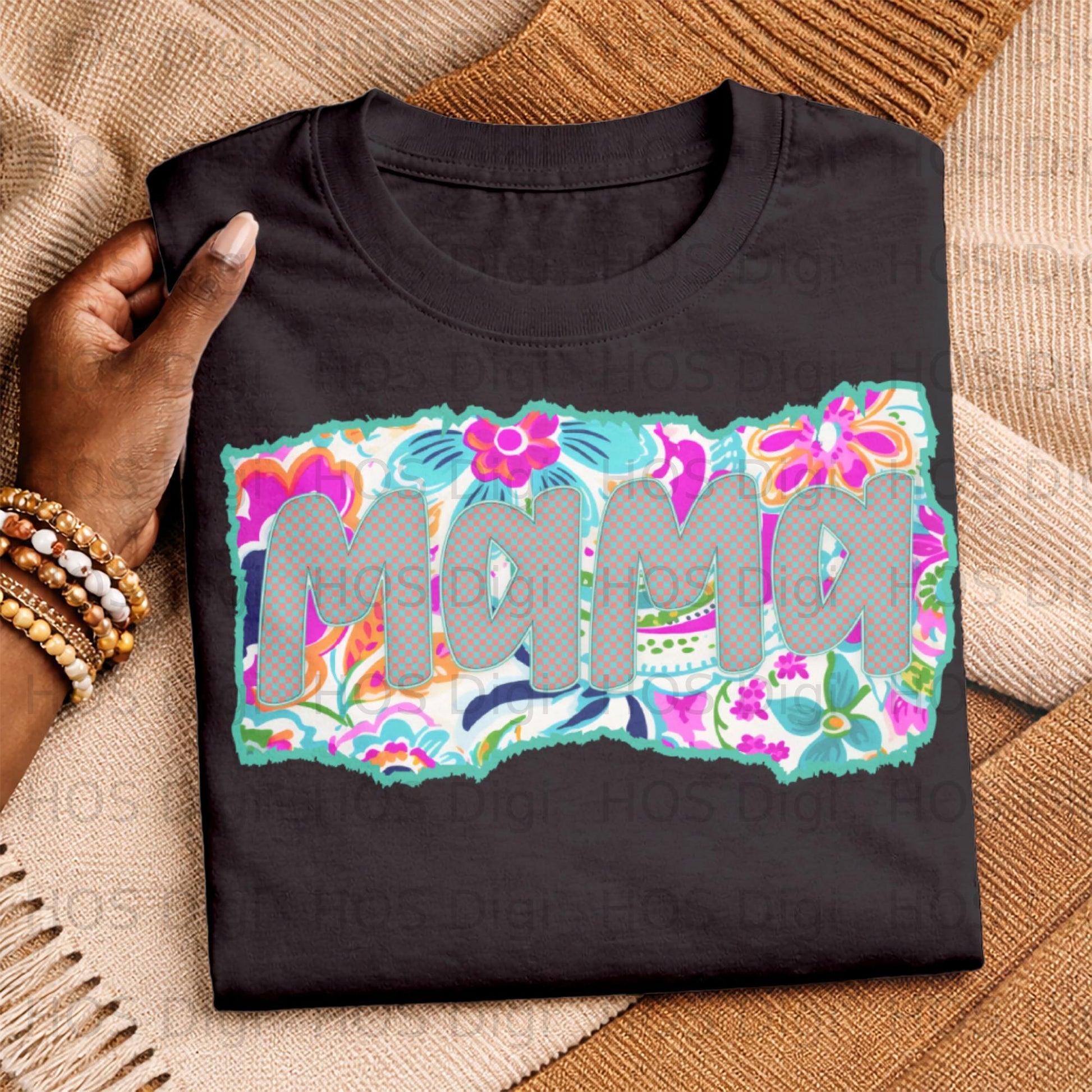 Black t-shirt with "Mama" in colorful floral distressed font.