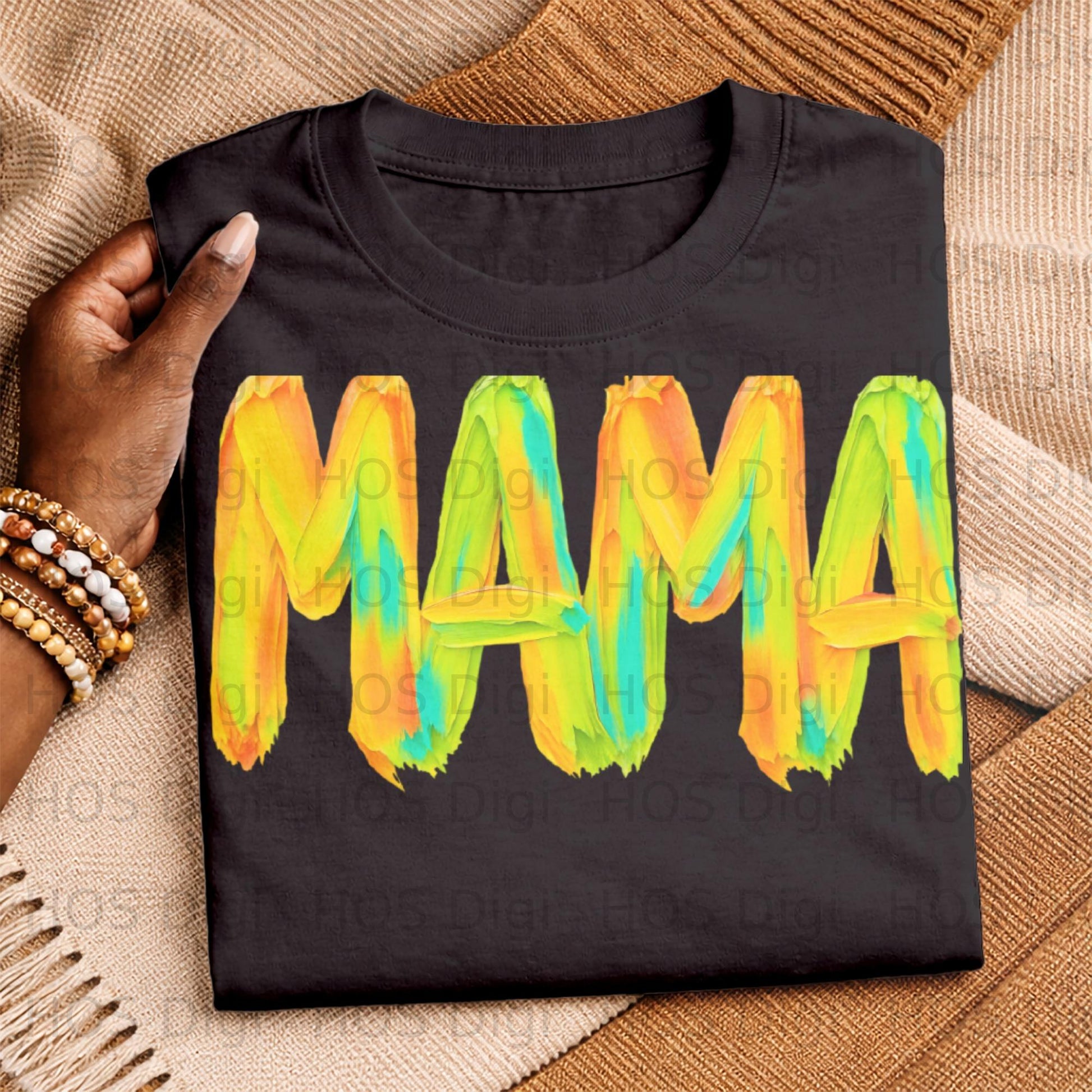 Black t-shirt with "MAMA" in colorful brushstroke letters.