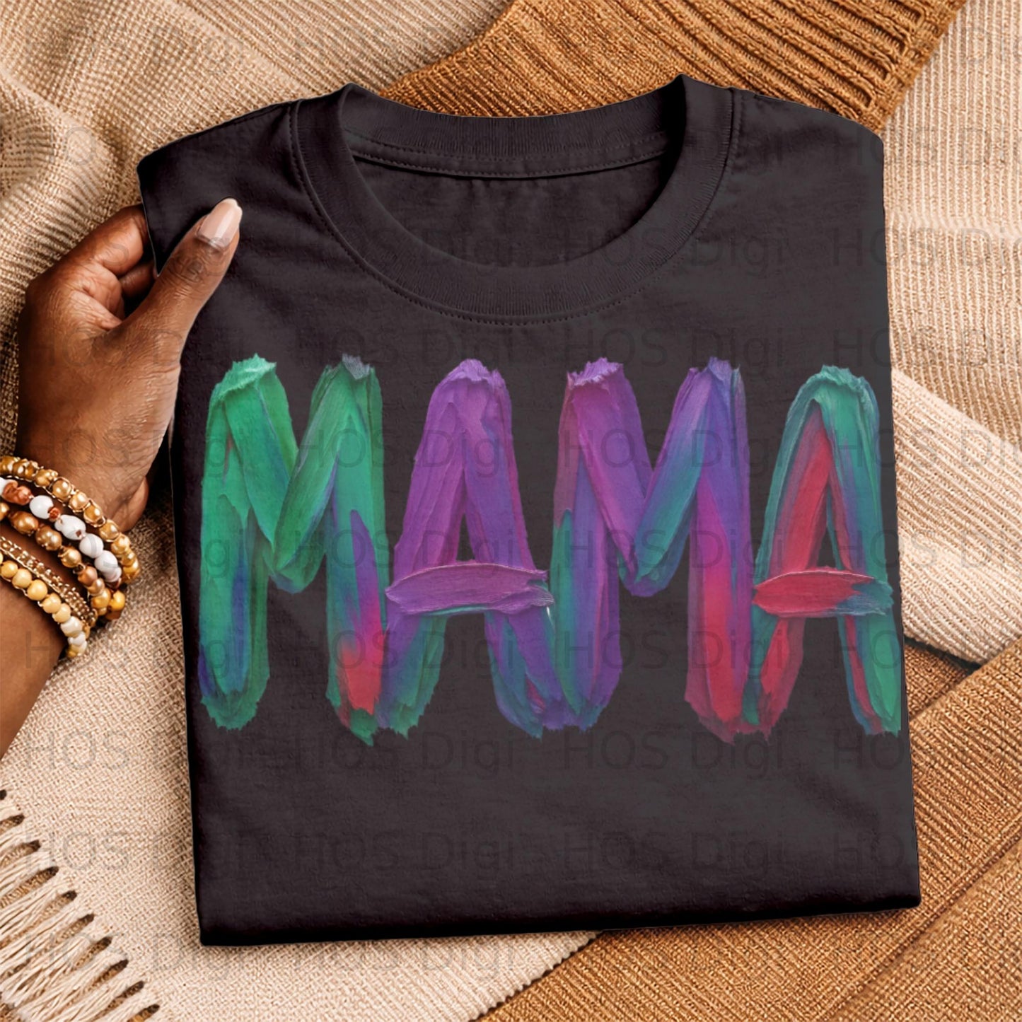 Black t-shirt with "MAMA" written in colorful, textured brushstrokes.