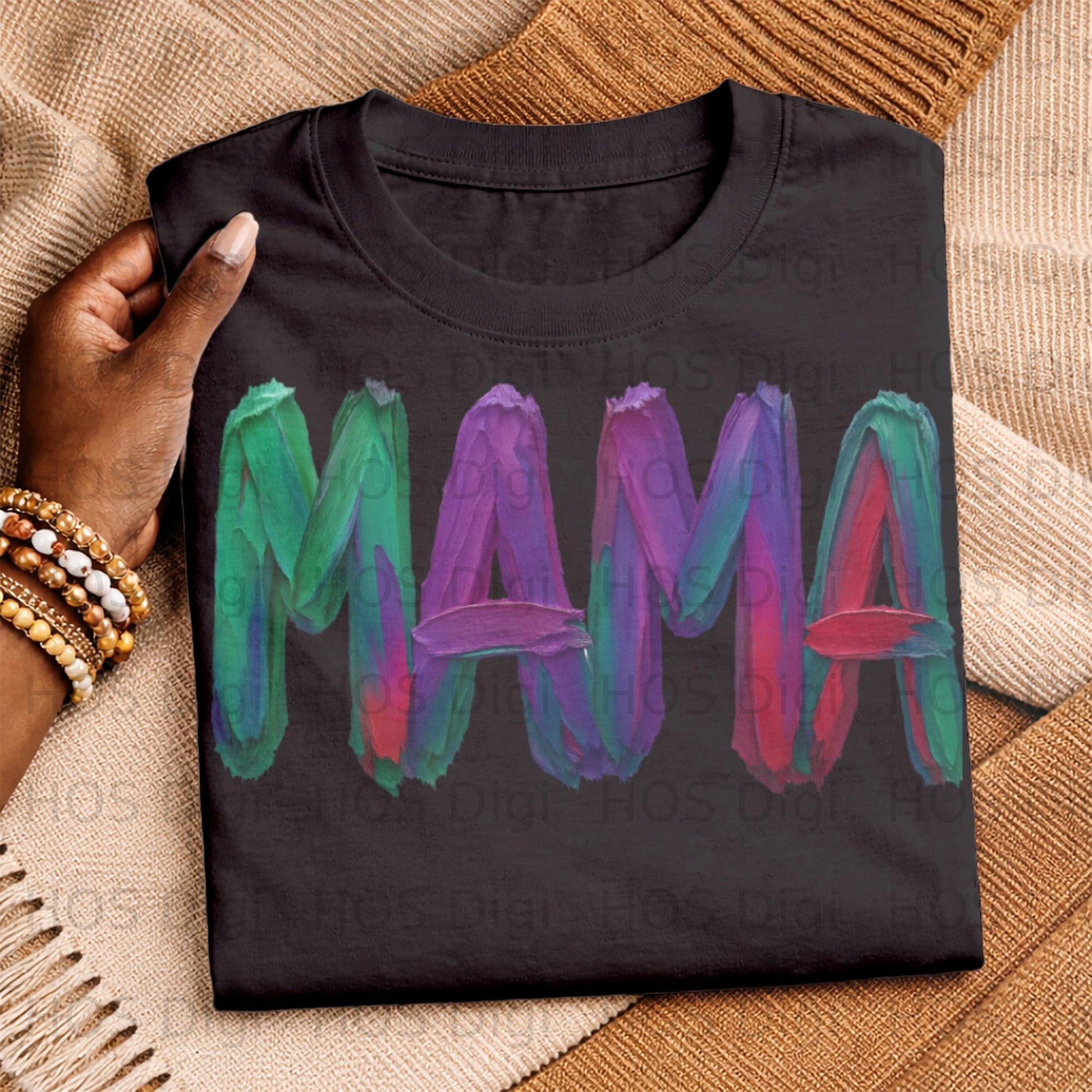 Black t-shirt with "MAMA" written in colorful, textured brushstrokes.